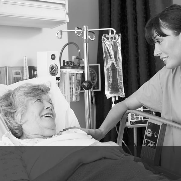Nurse Talking To Senior Woman